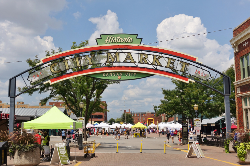 Entrance to the City Market in Kansas City with a vintage sign and booths in the background.