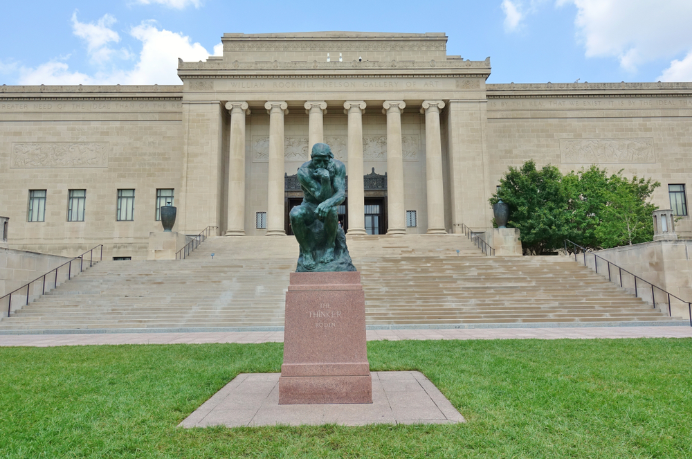 View of the Nelson-Atkins Museum with a replica of Rodin's "The Thinker" in front.