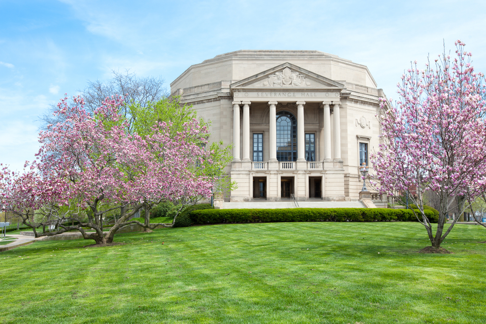 The front of the Cleveland Orchestra with flowering trees.