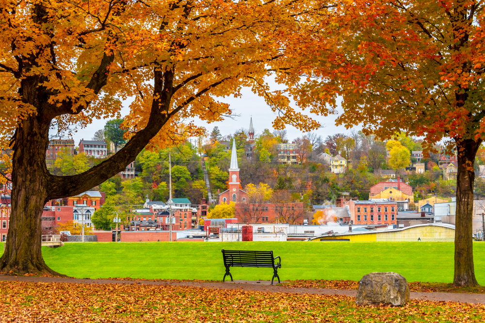 View of Galena, one of the prettiest small towns in Illinois, from a park with fall trees.