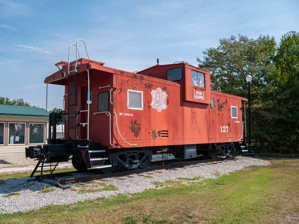 A old, red train caboose in New Franklin, MO.