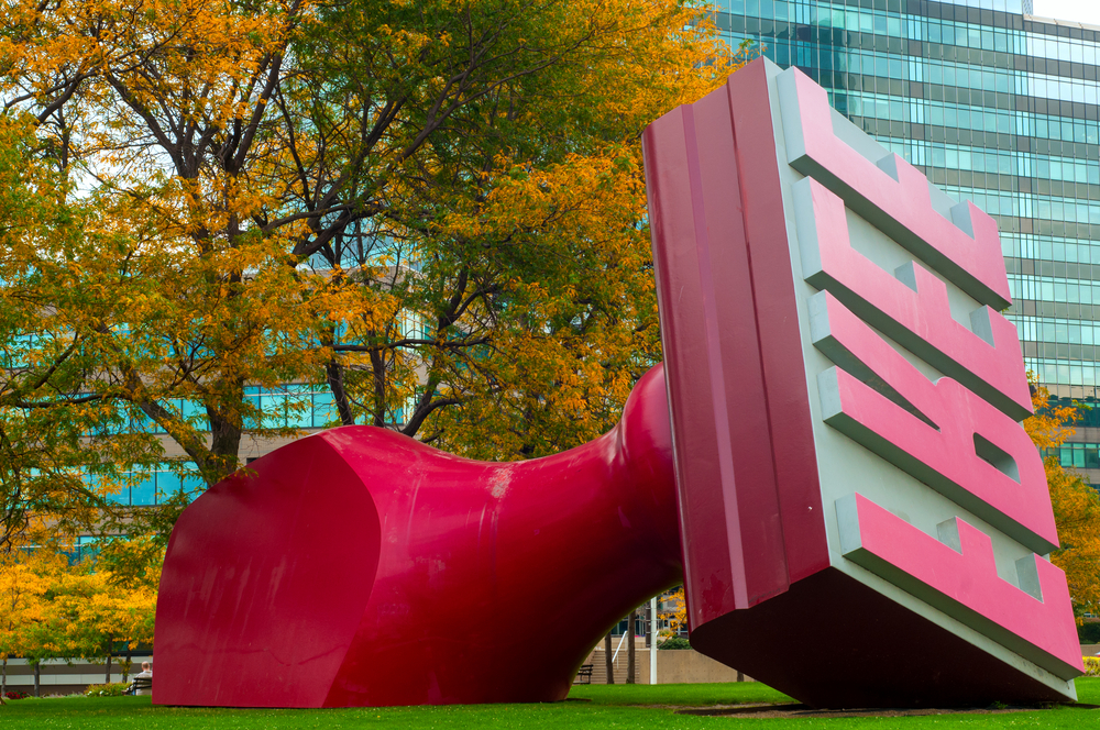 The World’s Largest Rubber Stamp laying on its side in a park in Cleveland.