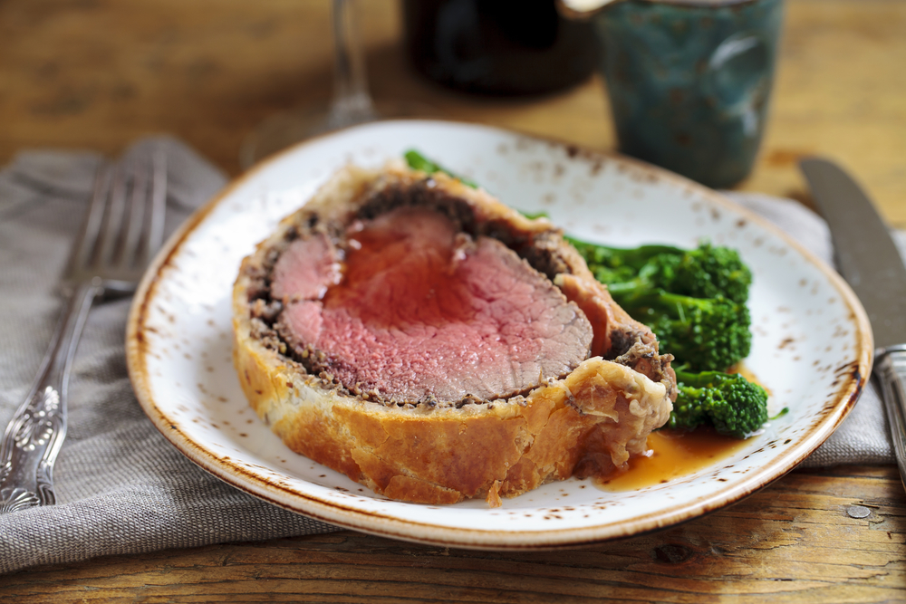 Beef wellington with broccoli on a plate