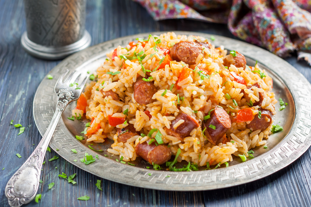 Jambalaya on a silver plate with a fork
