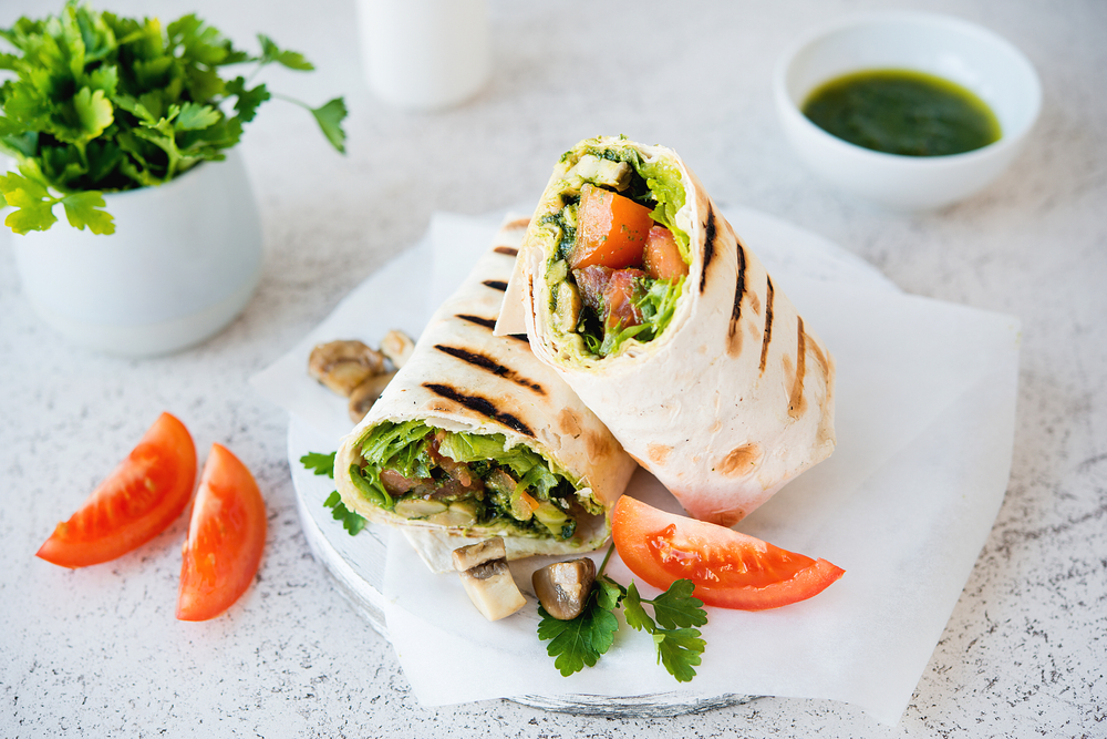 A burrito wrap filled with vegetables in an article about restaurants in Door County