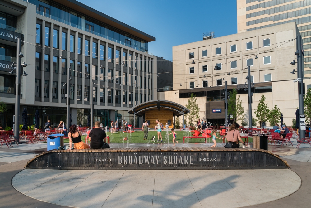 people enjoying in the space outside the building things to do in fargo