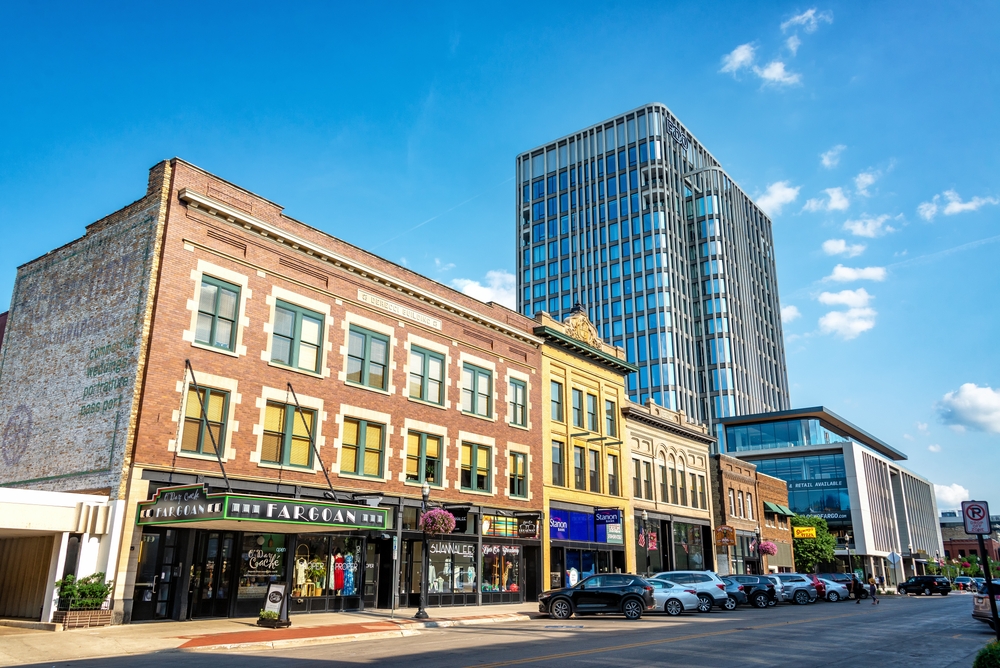 shops and buildings with cars parked in front things to do in fargo nd