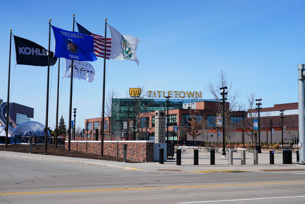 building with titletown board with flags flying in the front