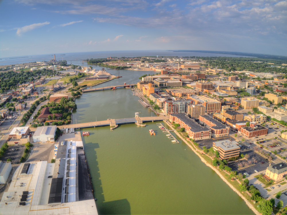 aerial view of the buildings and a river things to do in green bay