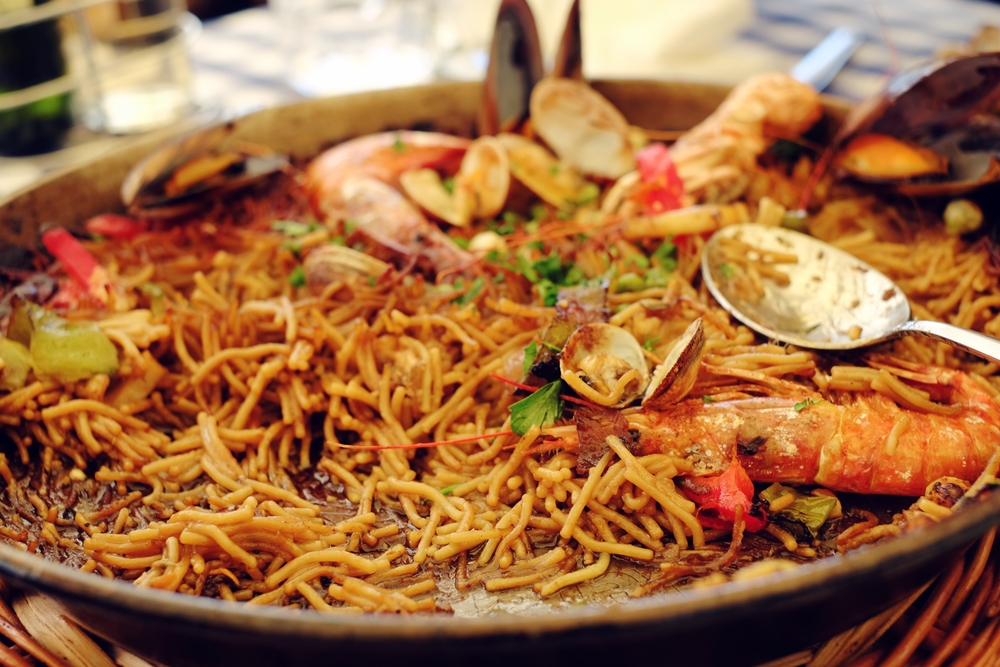 A platter of noddle paella in an article about Restaurants in Milwaukee