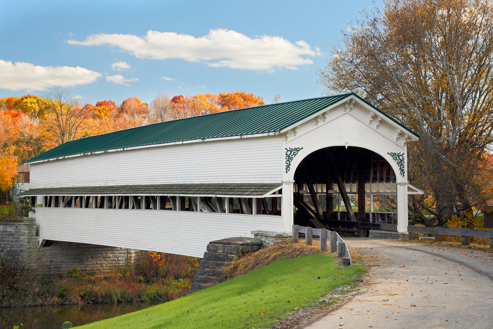 White covered bridge with green roof