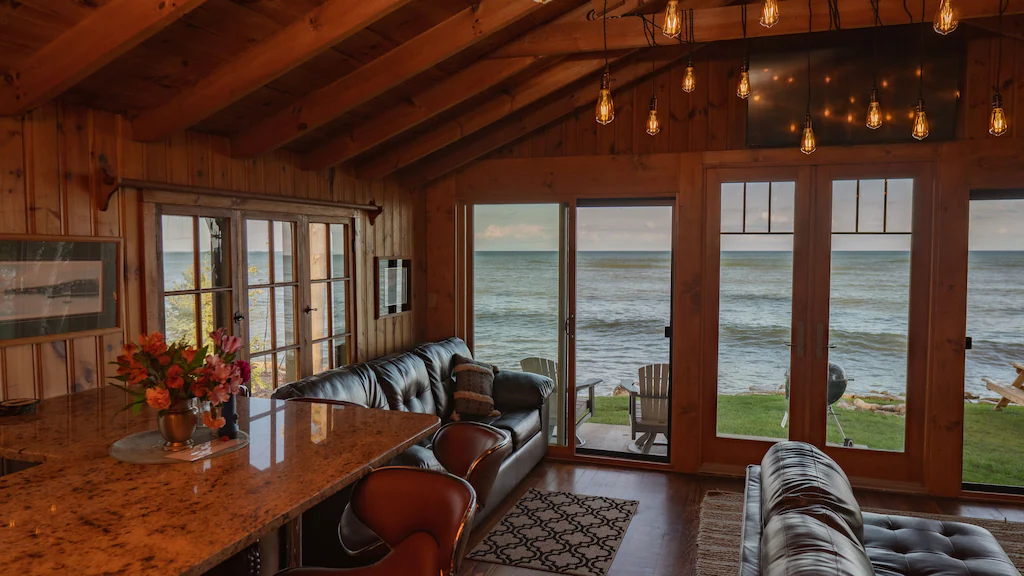 Inside of a cabin with a view over the river in an article about cabins in Door County