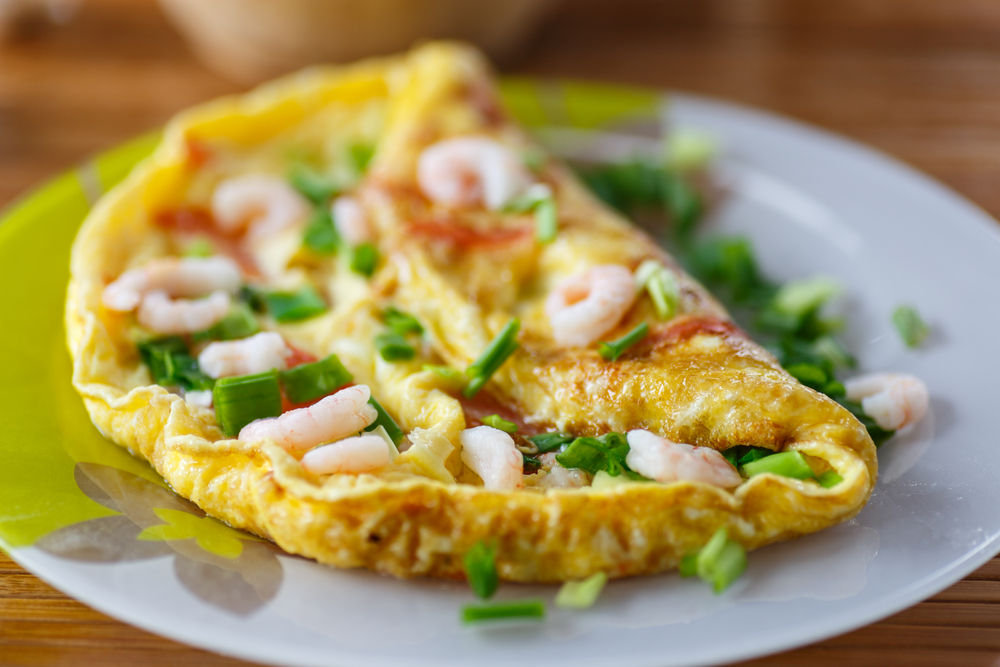 A shrimp omelet on a plate