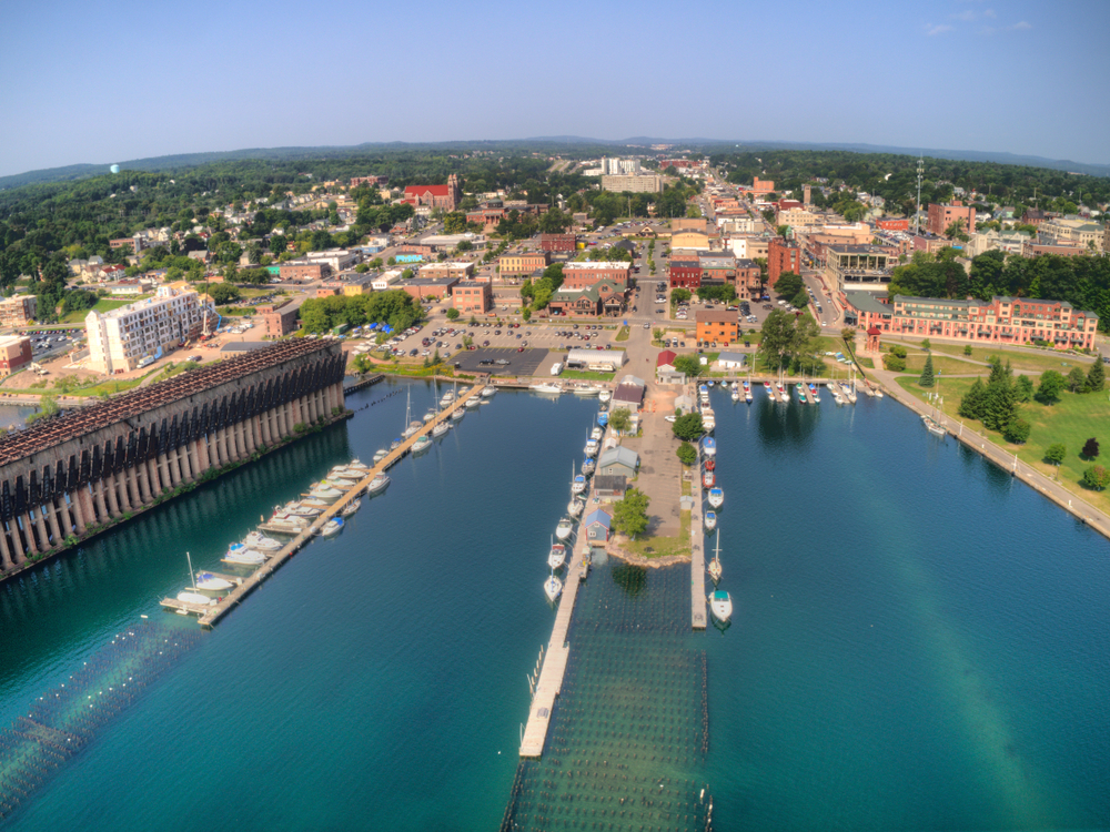 The harbor town of Marquette showing the part with boats and buildings in the distance.