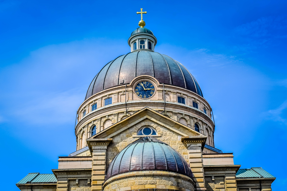 Exterior dome view of the Basilica of St. Josaphat a cream building with a black dome