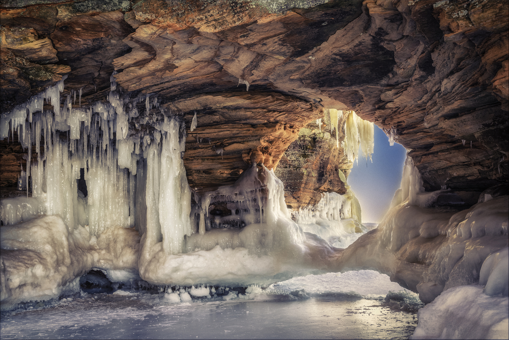 Inside one of the famous ice caves at the Apostle Islands, showing off the epic ice formations.