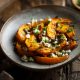 Roasted squash and feta cheese in a grey bowl in an article about restaurants in Springfield MO