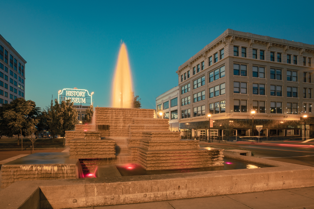 Downtown Springfield at Blue Hour with a fountain in the foreground and building in the background.