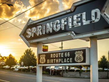 The Springfield sign which is a black arrow with route 66 birthplace written beneath