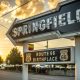The Springfield sign which is a black arrow with route 66 birthplace written beneath