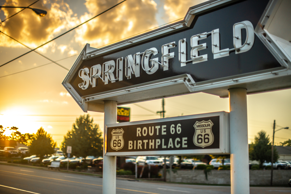 The Springfield sign which is a black arrow with route 66 birthplace written beneath