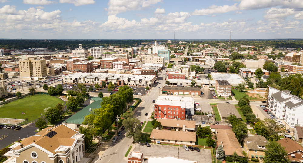 The downtown skyline of Springfield showing building from the air with trees in the background.