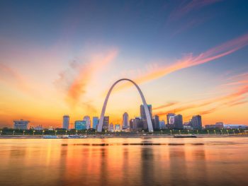 Gateway Arch with sunset in background places to visit in Missouri