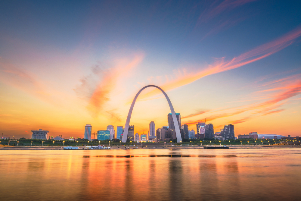 Gateway Arch with sunset in background places to visit in Missouri