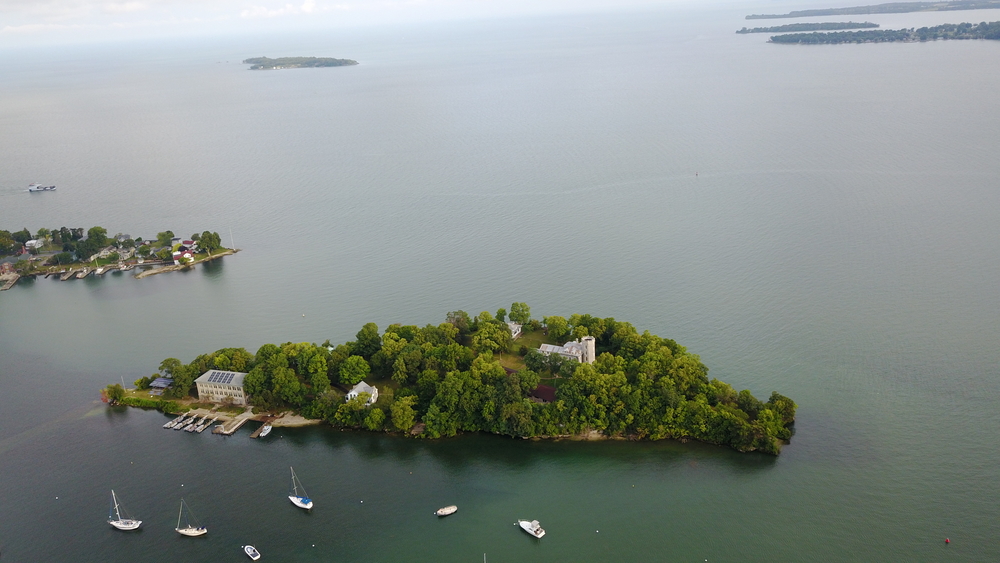 Aerial view of Gibraltar Island and boats in the water on a cloudy day.