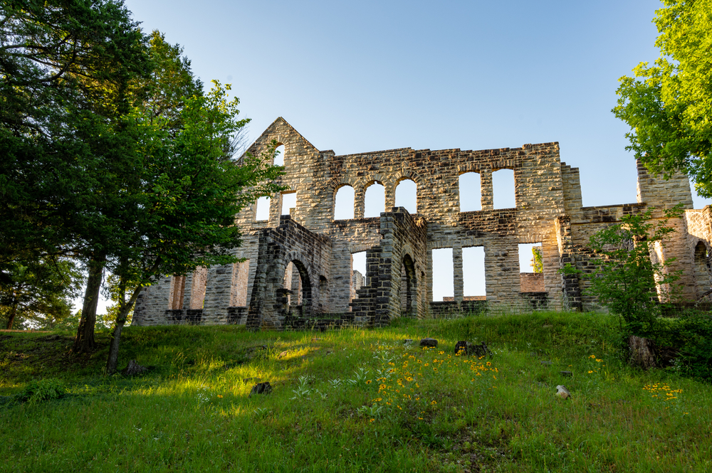 Looking up a hill at the castle ruins in Ha Ha Tonka State Park, one of the best places to visit in Missouri.