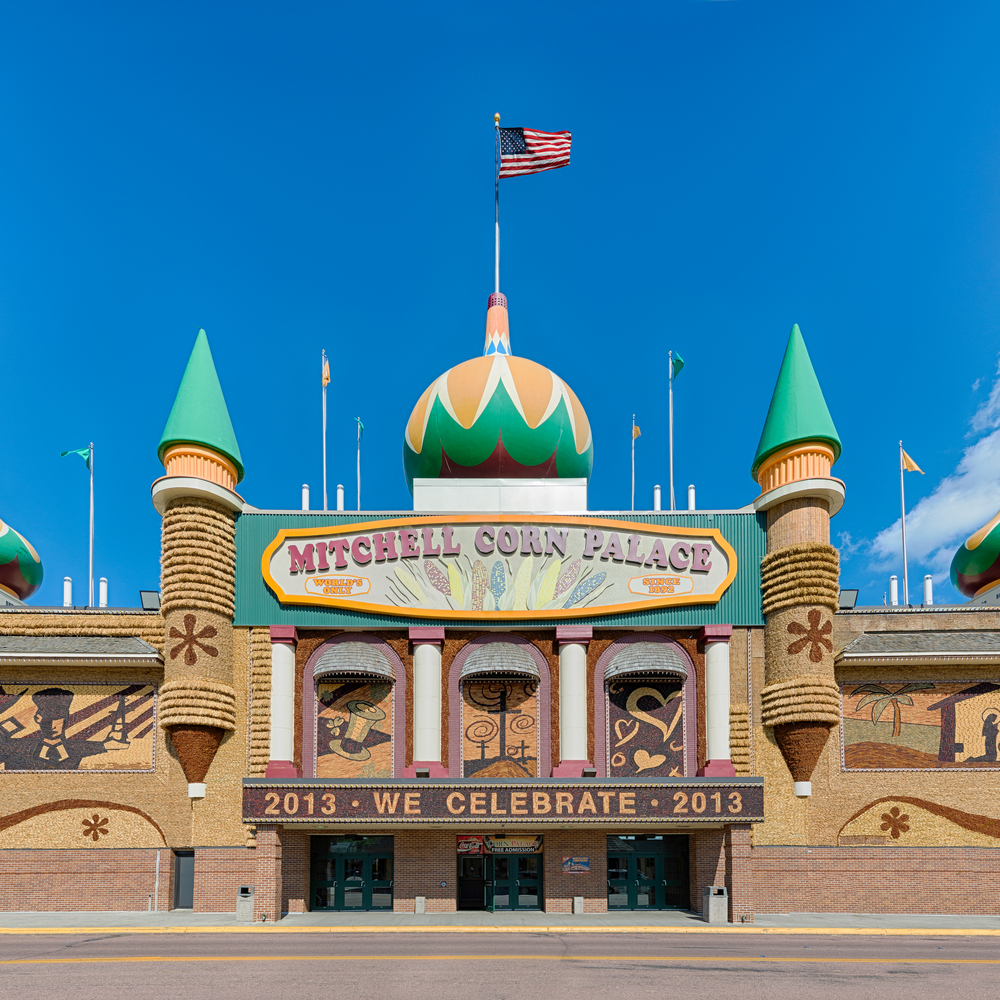 The front exterior of the Mitchell Corn Palace. It is a structure that looks like a palace and is covered in artwork created using corn. It's one of the best places to visit in the Midwest. 
