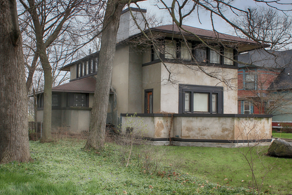 The K. C. DeRhodes House surrounded by bare trees.