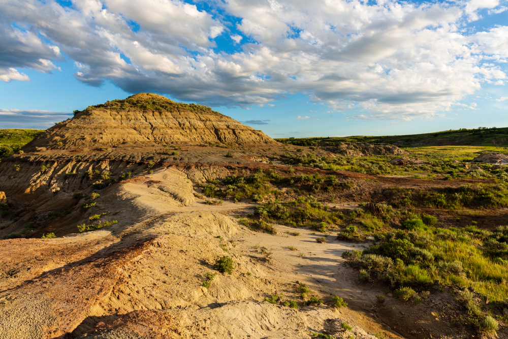View of prairies and rock formations during golden hour.