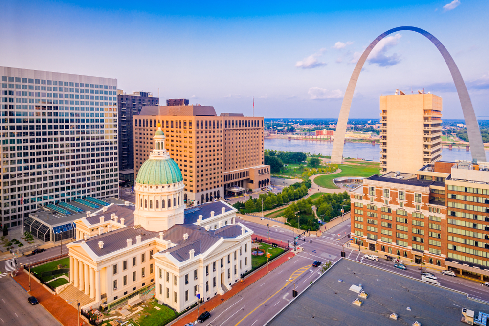 Aerial View of the Old Courthouse and Gateway Arch in downtown St. Louis at sunset.