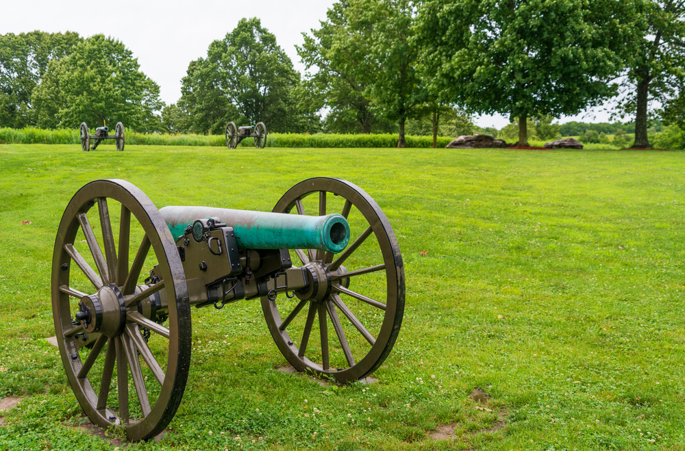 An old cannon on a green lawn at the Wilson's Creek National Battlefield, one of the best national parks in Missouri.