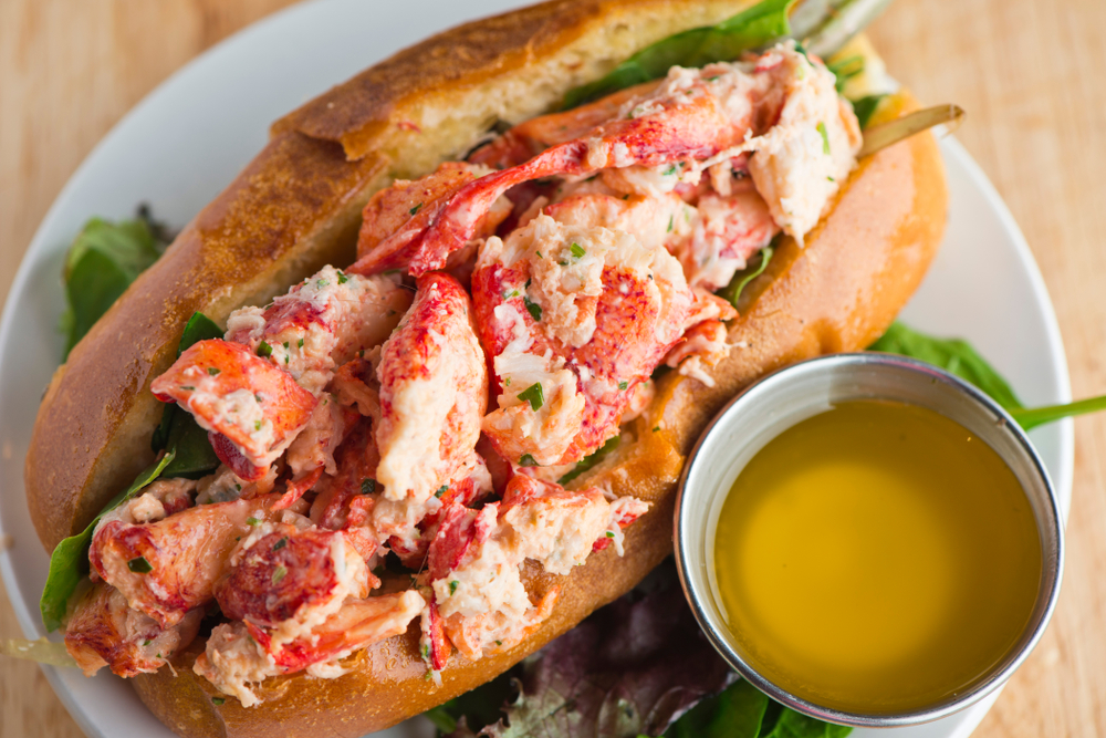 Lobster Roll. Traditional classic American Sandwich served in toasted hero roll with crisp lettuce and drawn butter. In an article about restaurants in Lake Geneva 