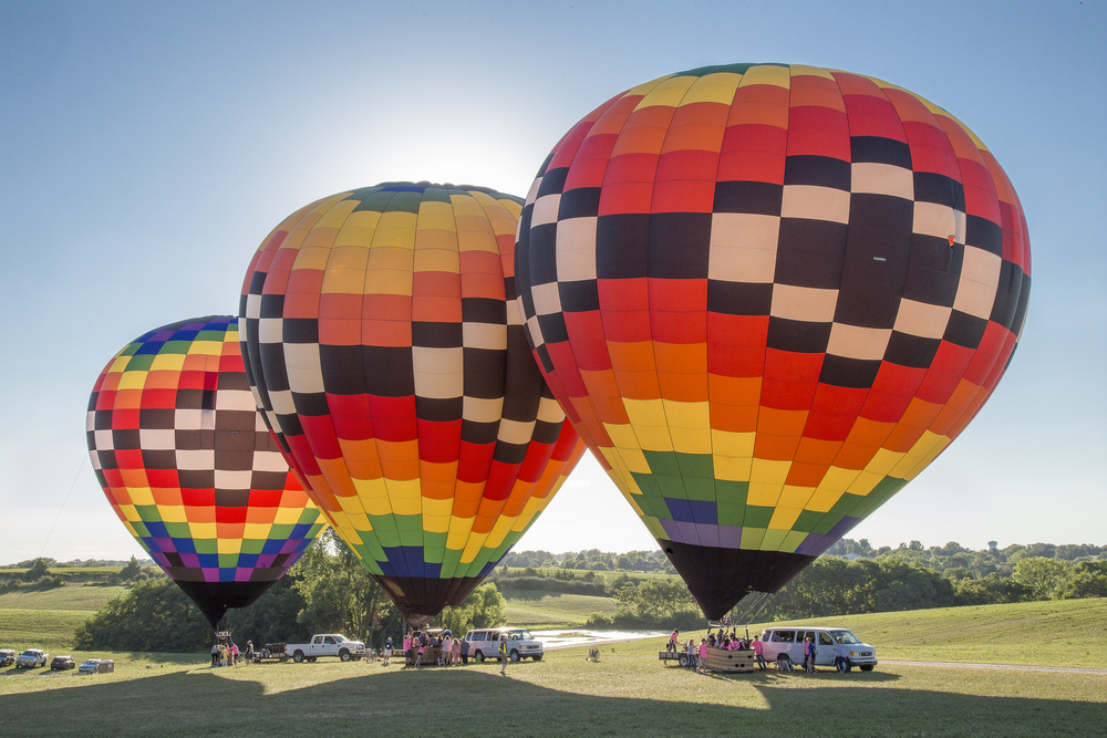Colorful hot air balloons on ground towns in iowa