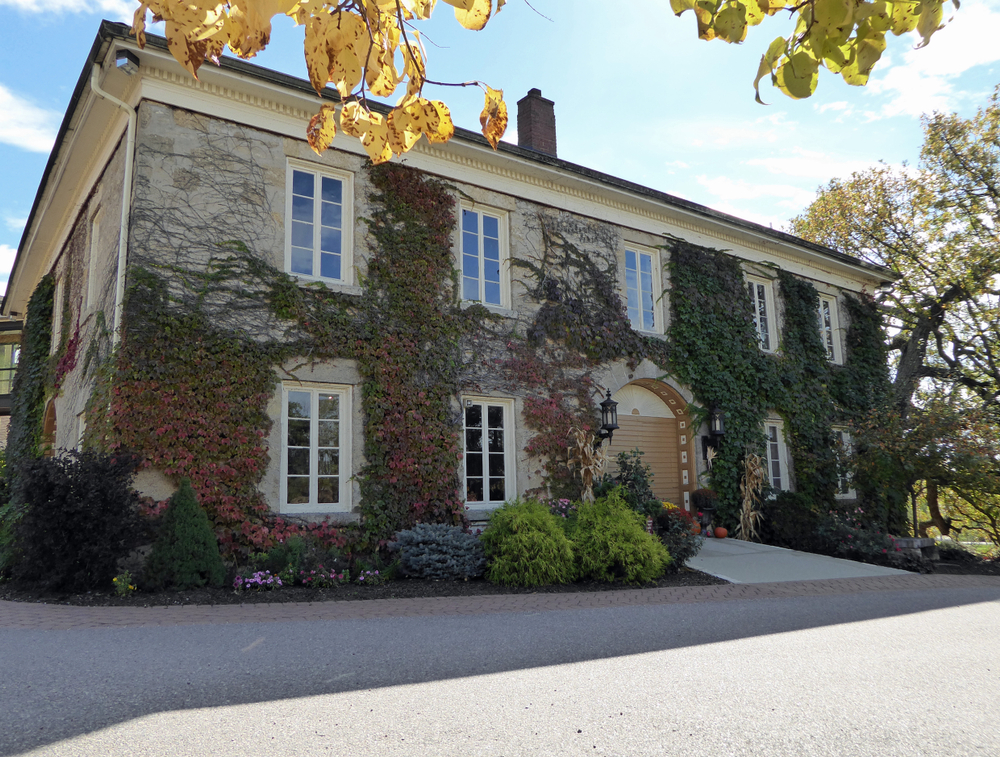 Wollersheim Winery and Distillery: original main building finished in 1867 in Prairie du Sac, Wisconsin. The building is stone covered in Ivy. 