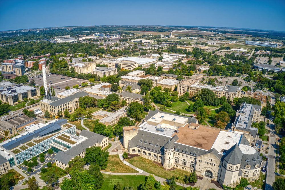 Aerial view of Manhattan, Kansas, featuring historic buildings.