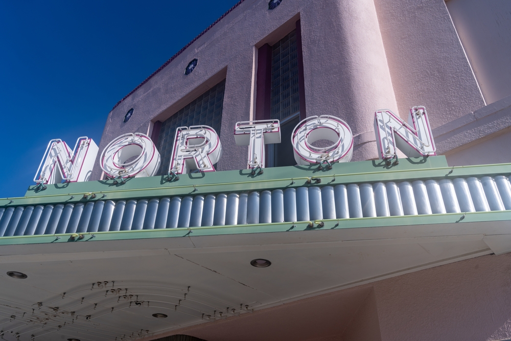Retro eon sign that reads "Norton" on a theater marquee.