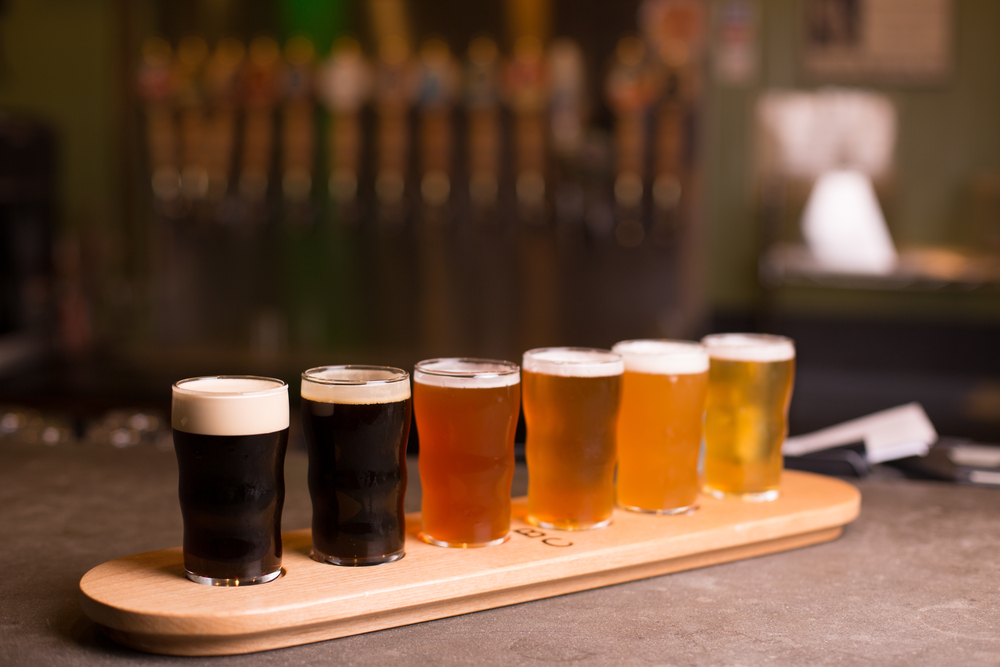 A flight of craft beers of different colors that you can find at breweries in Ohio. 