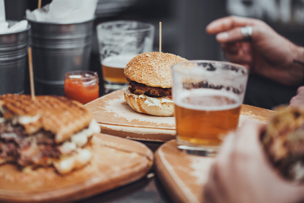 A table with sandwiches and beers, similar to what you'd find at breweries in Ohio. 