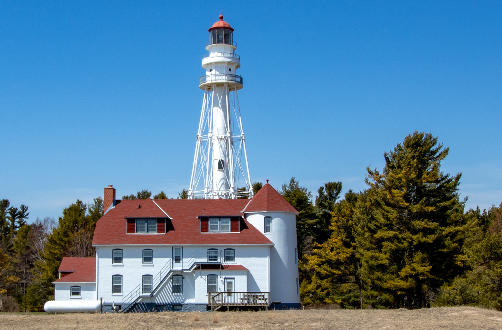 Rawley Point Lighthouse a white house light building with a large tower behind it. 