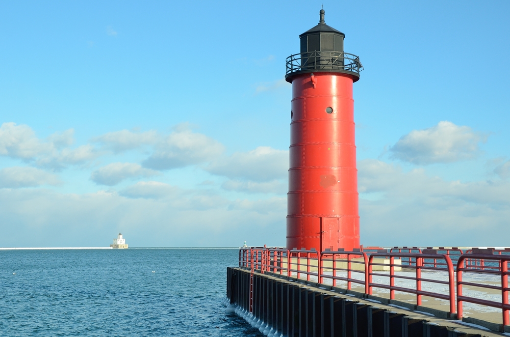Milwaukee Pierhead Lighthouse With Breakwater Light in the Distance. Its a red tower at the end of a pier and a great lighthouse in Wisconsin. 