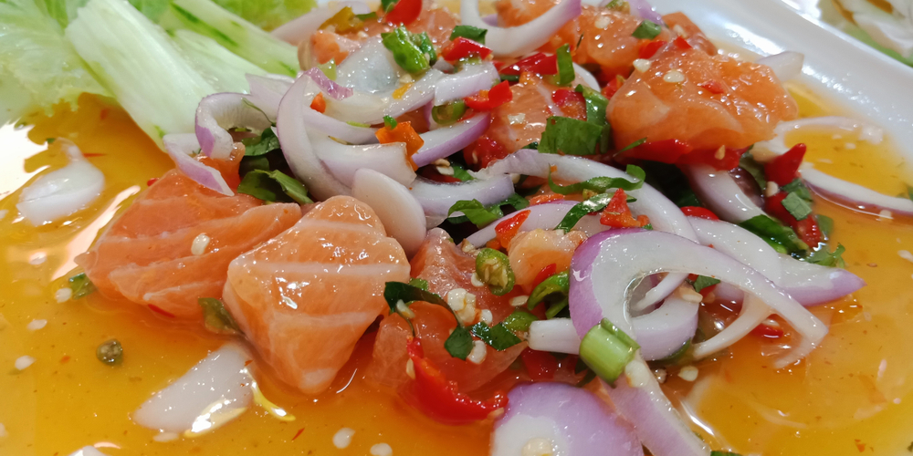 Salmon sashimi spicy salad on a plate in one of the restaurnats in Michigan City. 