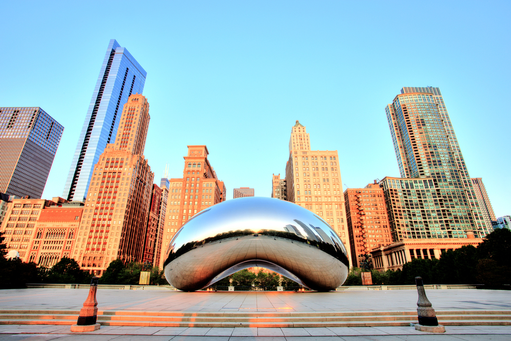 Golden hour at the Bean with the Chicago skyline in the background.