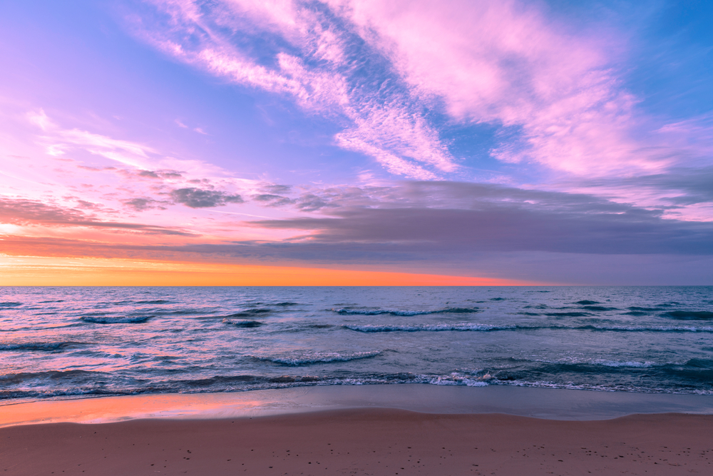 Colorful sunset over the lake and Silver Beach in St. Joseph, MI.