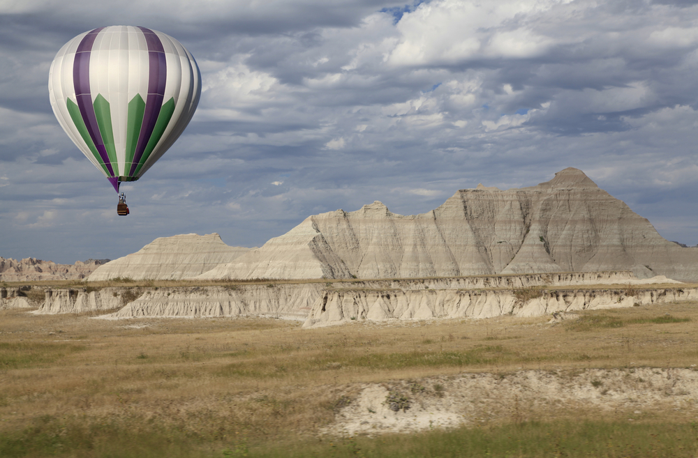 Hot Air Balloon Taking Off with south daoka hilld below 