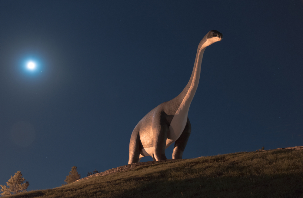 Dinosaur with moon rising in background, The Dinosaur Park, Rapid City, SD is one of the things to do in Rapid City 