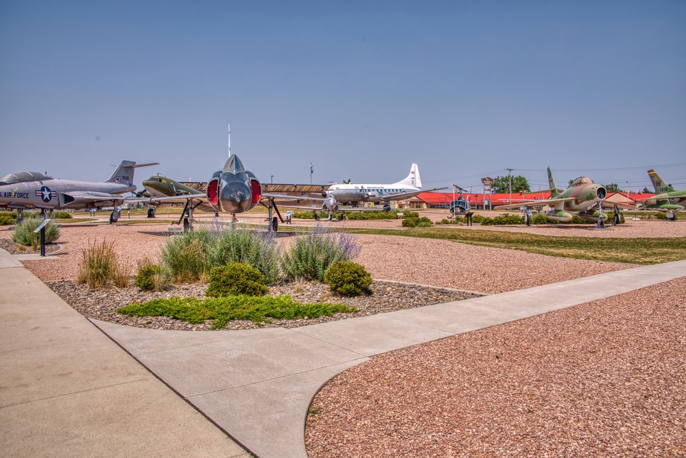  Air and Space Museum at Ellsworth Airforce Base showing vintage planes  in an exhibition area. 